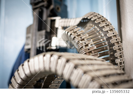 Metal manufacturing conveyor belt components moving through production 135605332