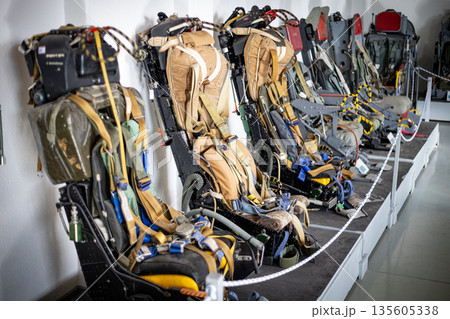 Ejection seats lining up in aviation museum exhibit 135605338