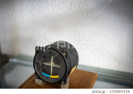 Artificial horizon indicator showing vintage aircraft attitude Artificial horizon indicator showing vintage aircraft attitude 135605339