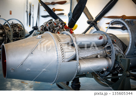 Jet engine displaying complex internal components and engineering Jet engine displaying complex internal components and engineering 135605344