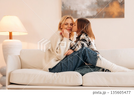 Good relationships, cozy. Mother and daughter are together in domestic room 135605477