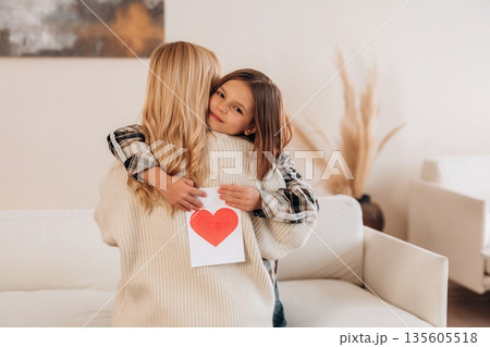 The mother's day gifts, celebration. Woman and her daughter are together The mother's day gifts, celebration. Woman and her daughter are together 135605518