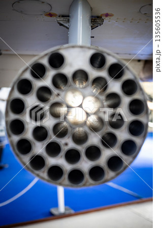Military aircraft rocket launcher showing many openings Military aircraft rocket launcher showing many openings 135605536
