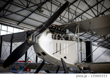 Vintage biplane propeller and engine showcasing early aviation engineering Vintage biplane propeller and engine showcasing early aviation engineering 135605553
