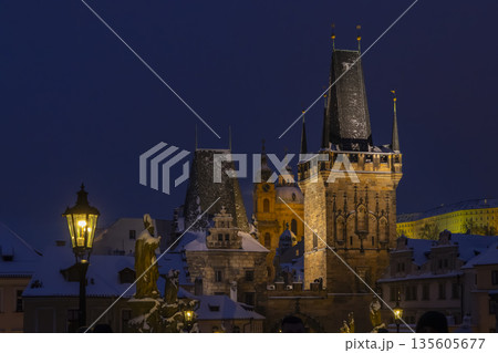 Prague Charles Bridge towers in winter night snow Prague Charles Bridge towers in winter night snow 135605677