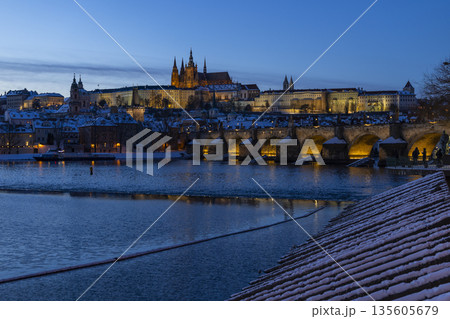 Prague Castle and Charles Bridge in winter evening snow Prague Castle and Charles Bridge in winter evening snow 135605679