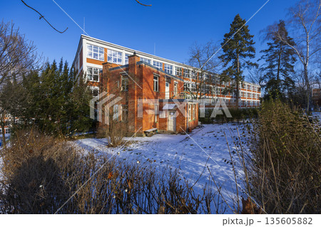 Zlin functionalism building standing in winter snow Zlin functionalism building standing in winter snow 135605882