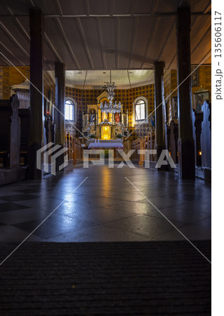 Church interior with bright altar and pews in Velke Karlovice Church interior with bright altar and pews in Velke Karlovice 135606117