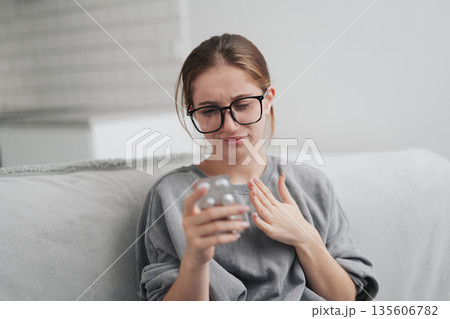 Young Girl Feels Bad At Home And Taking Cough Pills Young Girl Feels Bad At Home And Taking Cough Pills 135606782