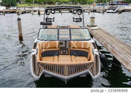 Docked luxury vessel. Boat trip. Yacht club. Sea vacation on summer. Boating and yachting charter. Summer vacation. Luxury boat in marina. Yacht at sea marina. Luxury boat motor yacht in marina Docked luxury vessel. Boat trip. Yacht club. Sea vacation on summer. Boating and yachting charter. Summer vacation. Luxury boat in marina. Yacht at sea marina. Luxury boat motor yacht in marina 135606906