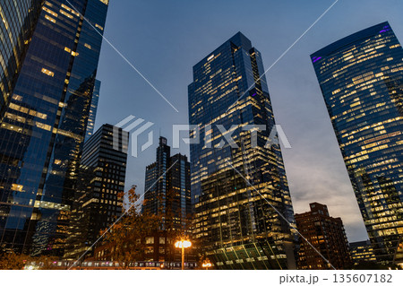 Chicago city with illuminated building. Night in Chicago city downtown. Skyscraper architecture. Chicago city cityscape. Cityscape night with skyscraper building. Glass buildings lit Chicago city with illuminated building. Night in Chicago city downtown. Skyscraper architecture. Chicago city cityscape. Cityscape night with skyscraper building. Glass buildings lit 135607182