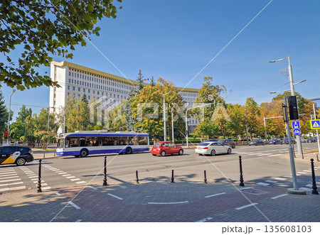 Chisinau, Moldova - September 24, 2025 Republic of Moldova parliament building with a view from the busy street traffic with cars and trolleybuses passing by Chisinau, Moldova - September 24, 2025 Republic of Moldova parliament building with a view from the busy street traffic with cars and trolleybuses passing by 135608103