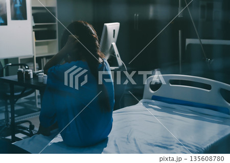 A patient with depression looks outside. 135608780