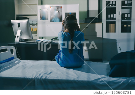 A patient with depression looks outside. A patient with depression looks outside. 135608781