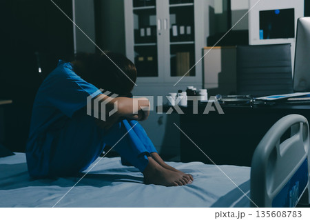 A patient with depression looks outside. A patient with depression looks outside. 135608783