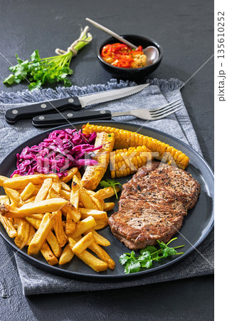 Texas Medium Rare Steak with Fries and Corn 135610252