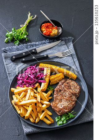 Texas Medium Rare Steak with Fries and Corn 135610253