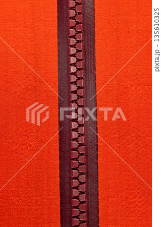 Close up of color zip on sport jacket , macro shot 135610325