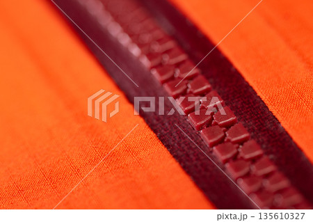 Close up of color zip on sport jacket , macro shot 135610327