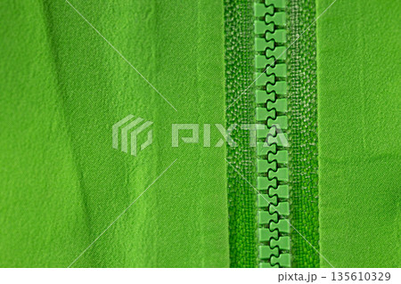 Close up of color zip on sport jacket , macro shot Close up of color zip on sport jacket , macro shot 135610329
