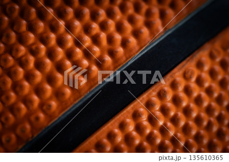 Macro close-up basketball ball with knurling and black line 135610365