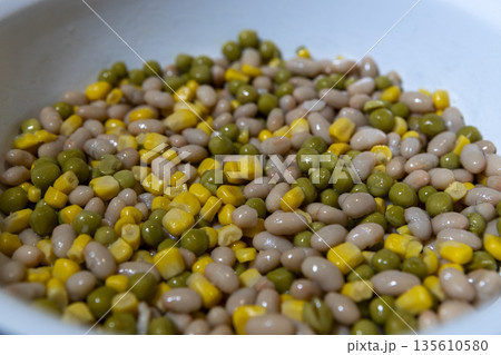 Colorful mixed vegetables in a bowl, top view, full background pattern 135610580