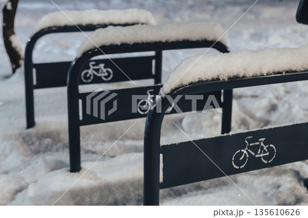 An icy bicycle parking area Shefield Long type, seen in the evening in winter 135610626