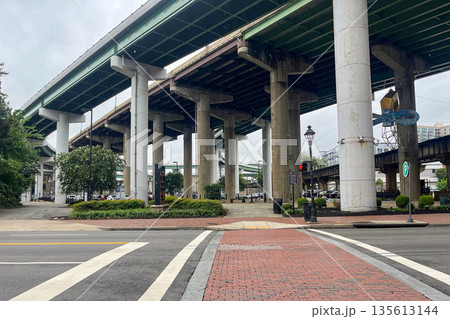 A busy street with a large bridge in the background. Main Street Station, Richmond. Virginia 135613144
