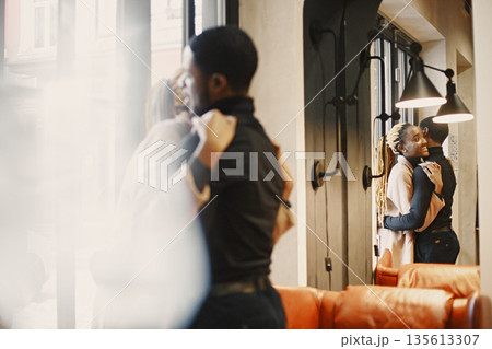 Two young people in cafe. African couple enjoying the time spending with each other. Two young people in cafe. African couple enjoying the time spending with each other. 135613307