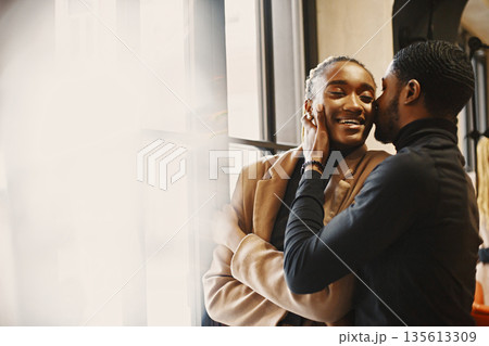 Two young people in cafe. African couple enjoying the time spending with each other. Two young people in cafe. African couple enjoying the time spending with each other. 135613309