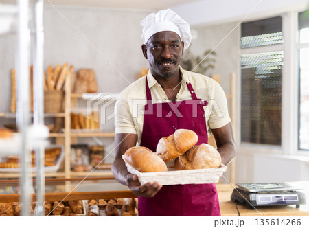 Portrait of positive man bakery worker Portrait of positive man bakery worker 135614266
