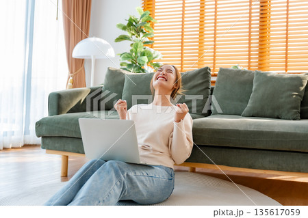 Funny euphoric young asian woman celebrating winning 135617059