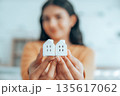 Happy Asian woman holding house. Concept property real estate and mortgage 135617062