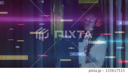 Gazing IT pro wearing blazer and red headset among server racks, notification overlays, copy space Gazing IT pro wearing blazer and red headset among server racks, notification overlays, copy space 135617515