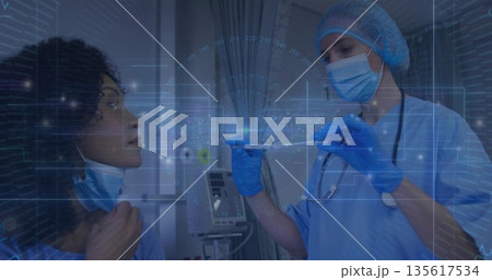 Nurse in scrubs holding test tube with blue liquid in exam room, with holographic data display 135617534