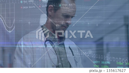 Doctor wearing lab coat and stethoscope analyzing 3D interface in clinic corridor, with binary code Doctor wearing lab coat and stethoscope analyzing 3D interface in clinic corridor, with binary code 135617627