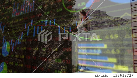 Gazing woman in dress on glass balcony railing, with binoculars, stock chart overlay, copy space Gazing woman in dress on glass balcony railing, with binoculars, stock chart overlay, copy space 135618727