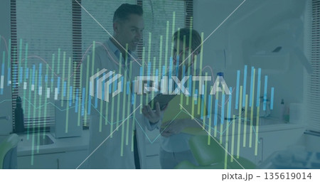 Reviewing medical professionals analyzing data in clinic room, with tablet and yellow folder Reviewing medical professionals analyzing data in clinic room, with tablet and yellow folder 135619014