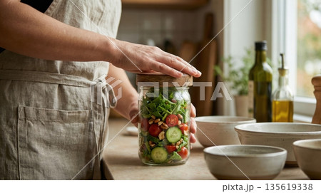 Modern Healthy Meal Prep with Glass Containers on Kitchen Table Modern Healthy Meal Prep with Glass Containers on Kitchen Table 135619338