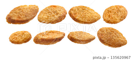 A set of bread croutons. Isolated on a white background A set of bread croutons. Isolated on a white background 135620967