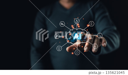 A person interacts with a glowing digital AI cloud interface surrounded by technology icons, symbolizing artificial intelligence integration,innovation,data analysis,and smart digital transformation. 135621045