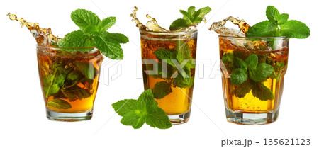 Set of Moroccan green mint tea splashing, isolated on white transparent background, concept of Arabic cuisine and summer drink Set of Moroccan green mint tea splashing, isolated on white transparent background, concept of Arabic cuisine and summer drink 135621123