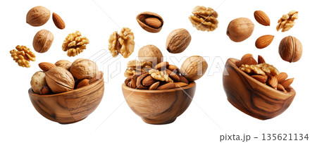 Assorted walnuts and almonds in natural wood bowl with some nuts floating above, isolated on white background 135621134