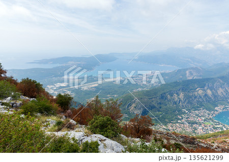 A sweeping hillside vantage captures a coastline and islands of Montenegro A sweeping hillside vantage captures a coastline and islands of Montenegro 135621299