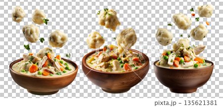 Hearty chicken and dumplings soup with peas and carrots in wooden bowl, floating dumplings, isolated on white background 135621381