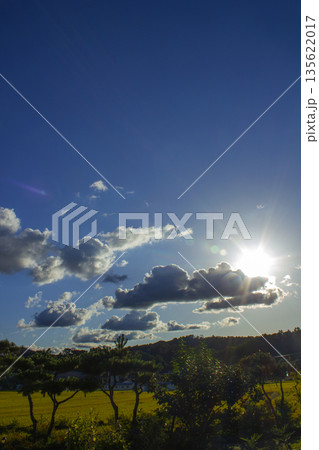 It's a blue sky with sunlight shining through it. It's a blue sky with sunlight shining through it. 135622017