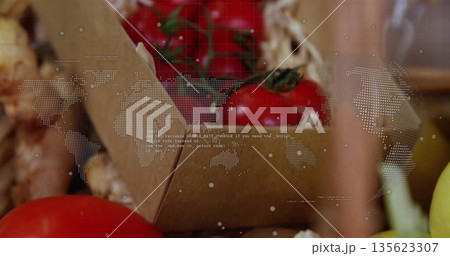 Featuring stemmed red tomatoes in box at stall, garlic bulbs, yellow onion, world map code overlay Featuring stemmed red tomatoes in box at stall, garlic bulbs, yellow onion, world map code overlay 135623307