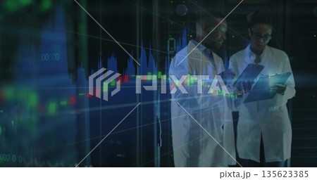 Lab scientists reviewing digital data in lab with tablet, stylus and data overlay, copy space 135623385