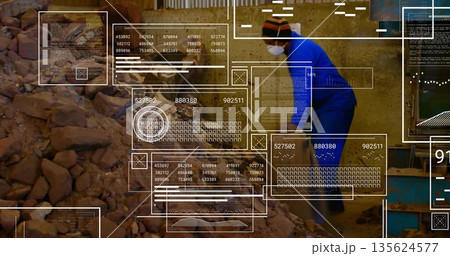 Man in blue coverall, mask monitoring data panels in processing plant, with rubble pile, copy space Man in blue coverall, mask monitoring data panels in processing plant, with rubble pile, copy space 135624577