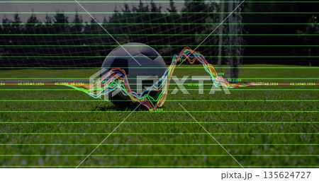 Displaying soccer ball on grass sports field with grid overlay, waveform and numeric annotations 135624727